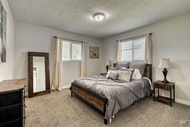 bedroom with a textured ceiling, baseboards, and light colored carpet