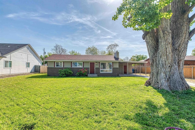 ranch-style home with brick siding, fence, a chimney, and a front yard