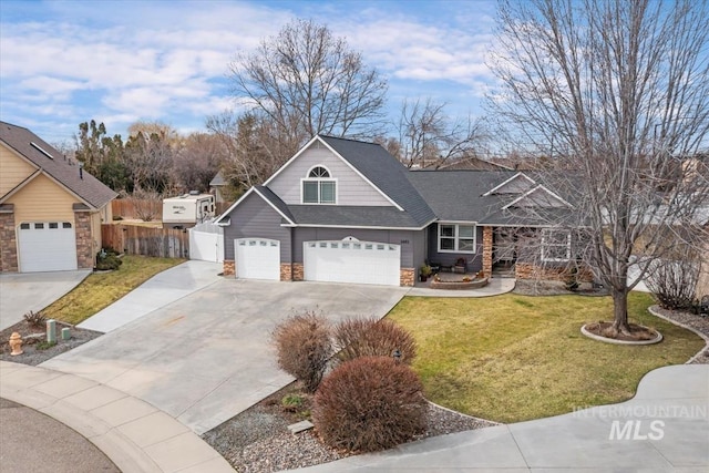 view of front facade with concrete driveway, fence, a garage, stone siding, and a front lawn