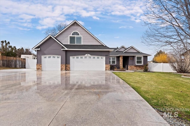 craftsman-style home featuring driveway, stone siding, an attached garage, fence, and a front lawn