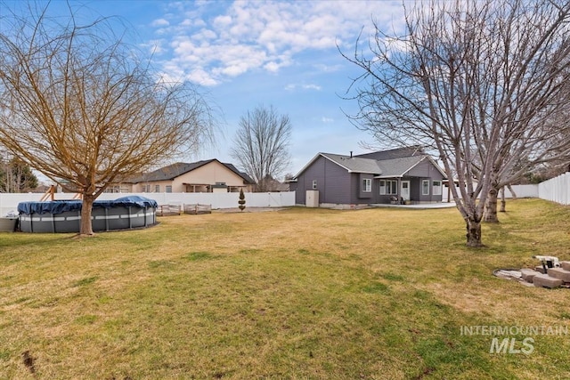 view of yard with a fenced backyard and a fenced in pool