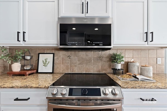 kitchen with appliances with stainless steel finishes, decorative backsplash, light stone counters, and white cabinets