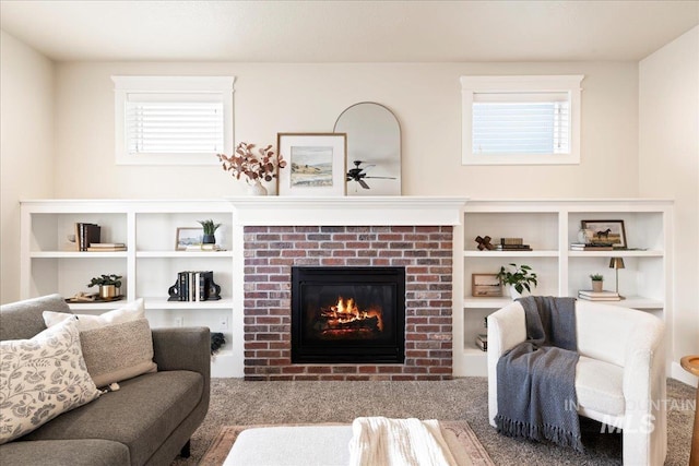 living room featuring a brick fireplace