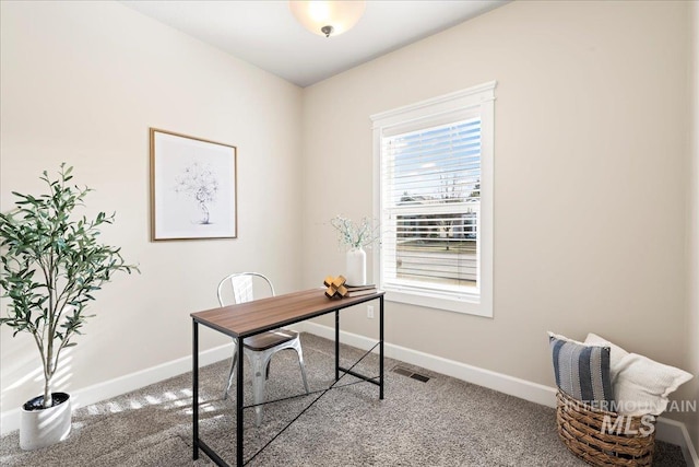 office space with carpet, visible vents, and baseboards