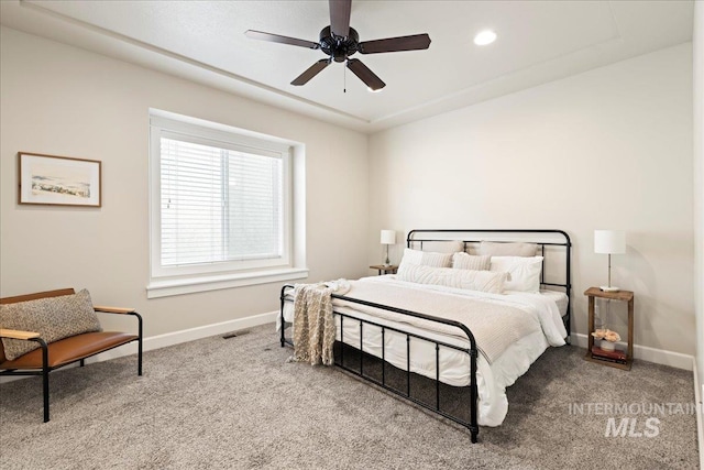 carpeted bedroom featuring visible vents, baseboards, a ceiling fan, and recessed lighting