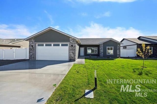 ranch-style home featuring a garage and a front lawn