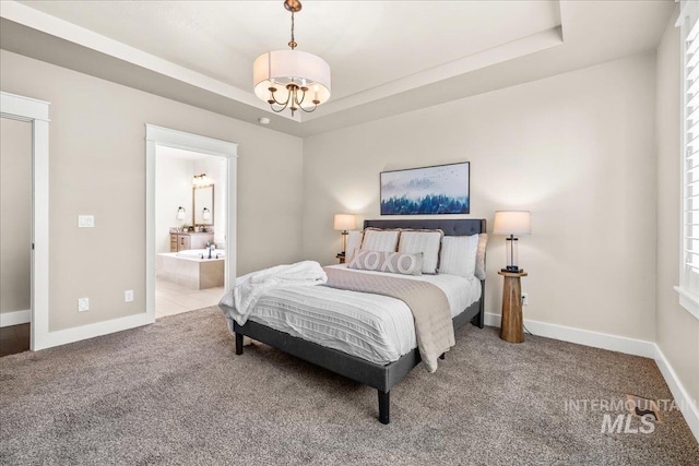 495 W Tall Prairie Dr, Meridian, ID 83642 - bedroom with a tray ceiling, carpet flooring, baseboards, a chandelier, and connected bathroom