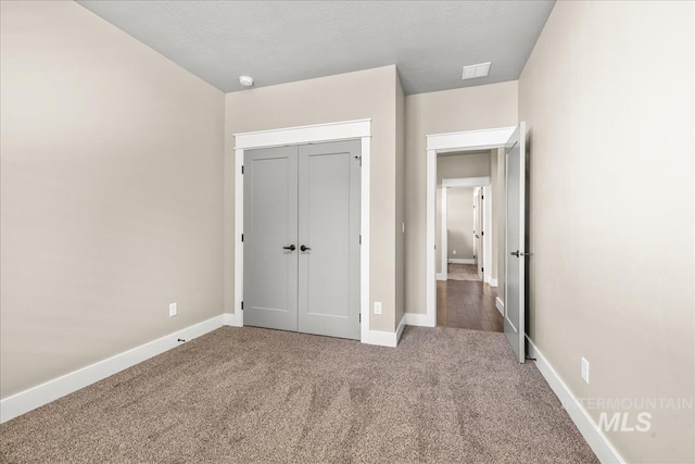 495 W Tall Prairie Dr, Meridian, ID 83642 - unfurnished bedroom featuring carpet floors, baseboards, and a closet