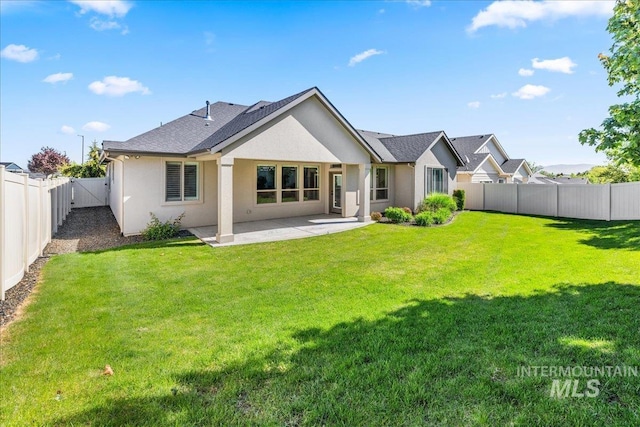 495 W Tall Prairie Dr, Meridian, ID 83642 - rear view of property with a patio and stucco siding