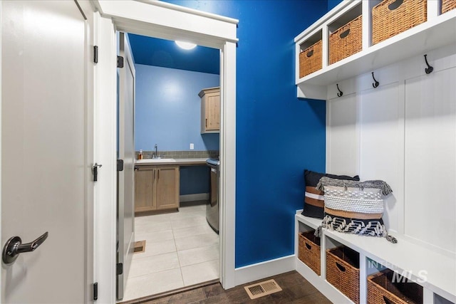 495 W Tall Prairie Dr, Meridian, ID 83642 - mudroom featuring baseboards, light tile patterned floors, and a sink