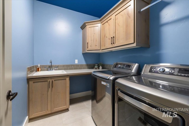 495 W Tall Prairie Dr, Meridian, ID 83642 - clothes washing area featuring cabinet space, washer and dryer, and light tile patterned floors