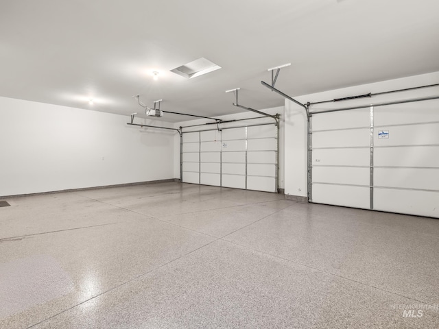 495 W Tall Prairie Dr, Meridian, ID 83642 - garage featuring a garage door opener and baseboards