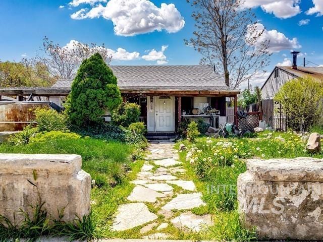 3009 W Woodlawn, Boise, ID 83702 - back of property featuring fence and a porch