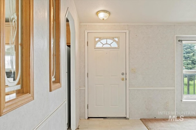 foyer entrance with arched walkways