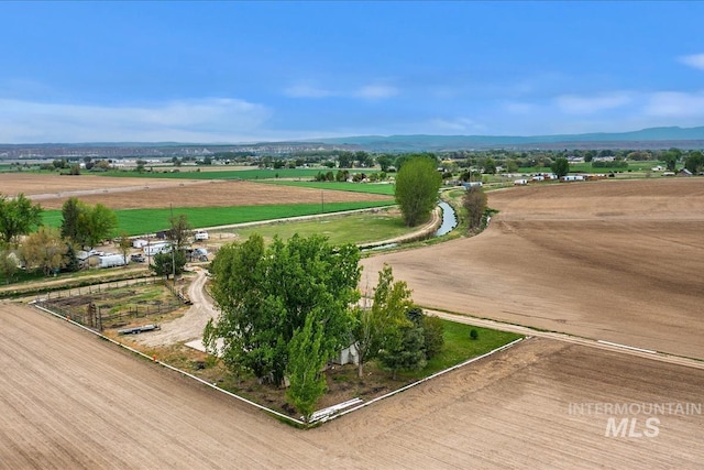 aerial view featuring a rural view and a mountain view