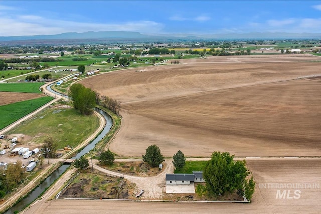 birds eye view of property with a mountain view