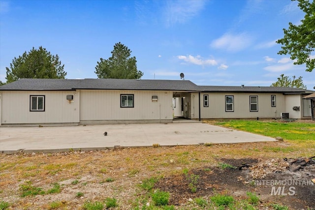 view of front of house featuring a patio area and cooling unit