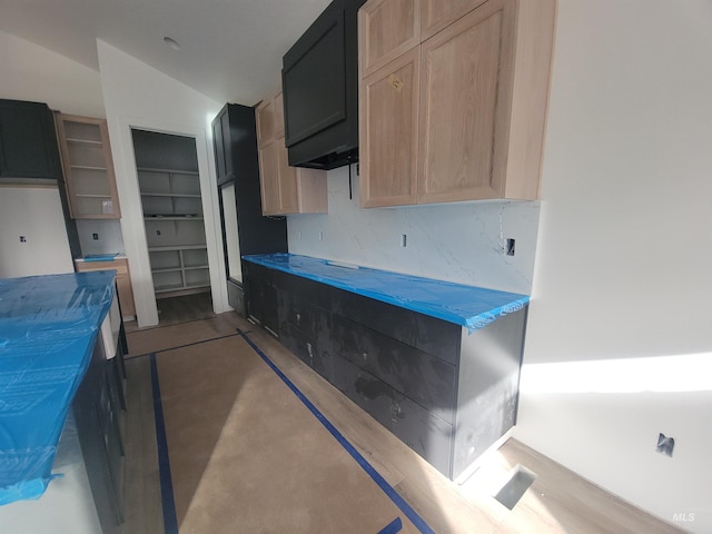 kitchen featuring light brown cabinetry