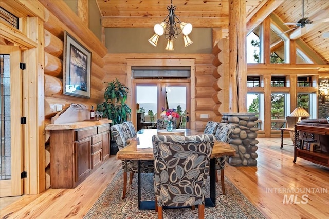 1533 Pine Lakes Ranch Dr, Cascade, ID 83611 - dining space featuring rustic walls, a wooden ceiling with exposed beams, light wood finished floors, a chandelier, and high vaulted ceiling