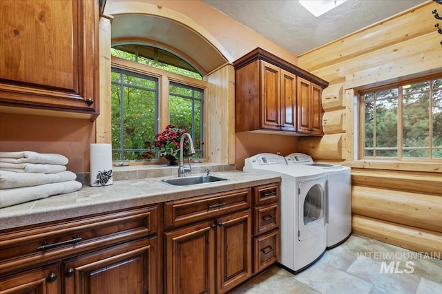 1533 Pine Lakes Ranch Dr, Cascade, ID 83611 - washroom with cabinet space and washing machine and clothes dryer