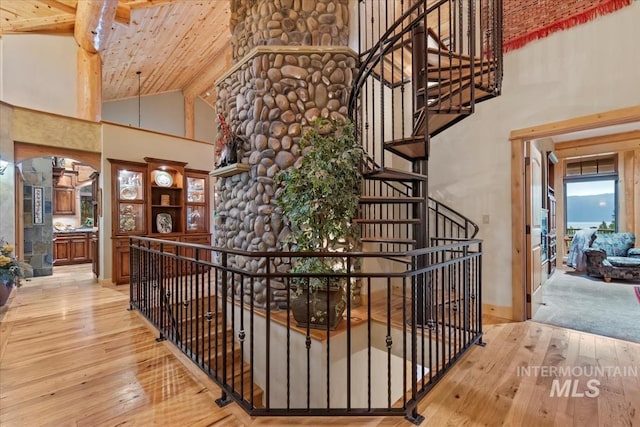 1533 Pine Lakes Ranch Dr, Cascade, ID 83611 - stairway featuring high vaulted ceiling, hardwood / wood-style flooring, and wooden ceiling