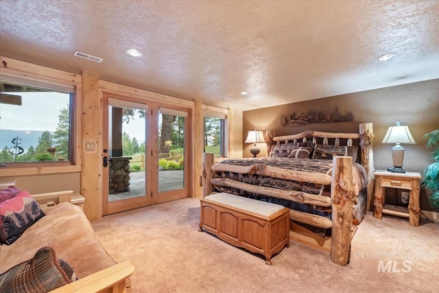 1533 Pine Lakes Ranch Dr, Cascade, ID 83611 - bedroom with access to outside, light carpet, a textured ceiling, and recessed lighting