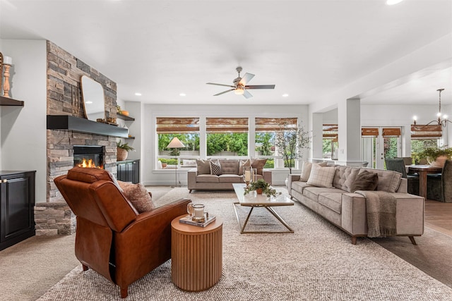1912 N Bottle Creek Pl, Eagle, ID 83616 - living area with a fireplace, a ceiling fan, recessed lighting, and a chandelier