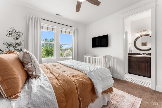 1912 N Bottle Creek Pl, Eagle, ID 83616 - bedroom with carpet flooring, a ceiling fan, ensuite bath, and a sink