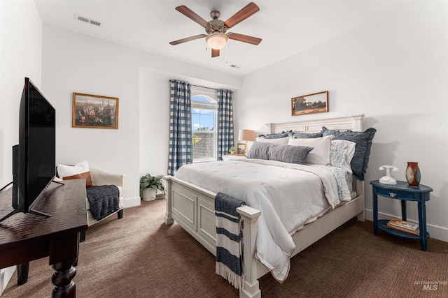 1912 N Bottle Creek Pl, Eagle, ID 83616 - bedroom featuring dark carpet, baseboards, and a ceiling fan