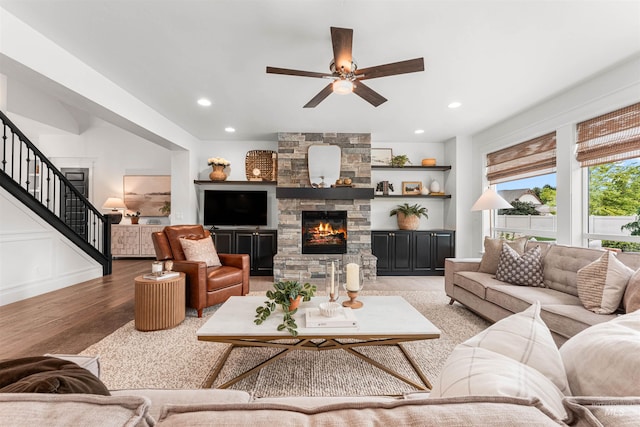 1912 N Bottle Creek Pl, Eagle, ID 83616 - living area with stairs, ceiling fan, wood finished floors, recessed lighting, and a stone fireplace
