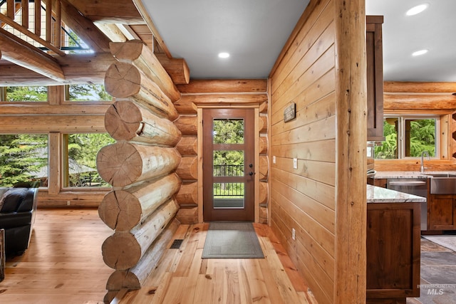 881 Sheila, Mccall, ID 83638 - doorway with rustic walls, recessed lighting, and light wood-style floors