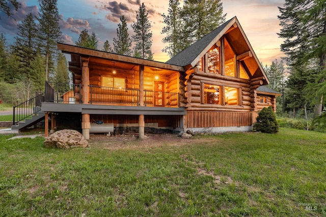 881 Sheila, Mccall, ID 83638 - rear view of property featuring log siding, a yard, and stairway
