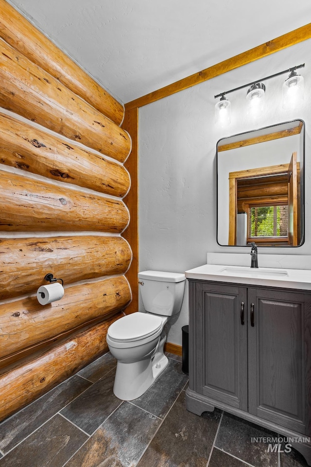 881 Sheila, Mccall, ID 83638 - bathroom featuring log walls and vanity