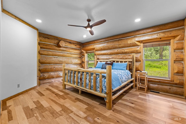 881 Sheila, Mccall, ID 83638 - bedroom with wood finished floors, recessed lighting, and log walls
