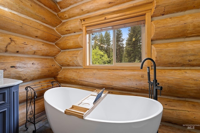 881 Sheila, Mccall, ID 83638 - full bath with log walls, a freestanding tub, and vanity