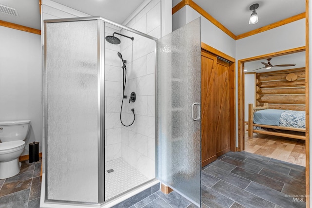 881 Sheila, Mccall, ID 83638 - ensuite bathroom with a stall shower, stone tile floors, and ceiling fan