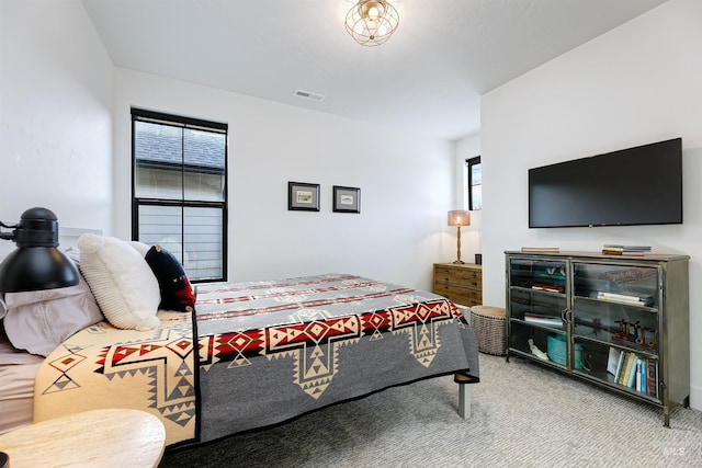 carpeted bedroom with visible vents