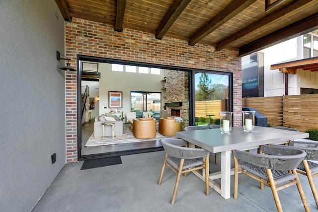 view of patio / terrace featuring outdoor dining area and fence