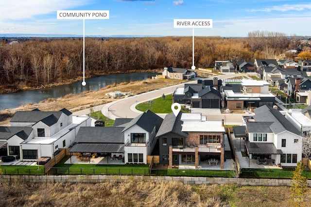 birds eye view of property with a residential view and a water view