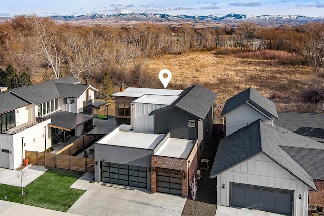 drone / aerial view featuring a mountain view and a residential view