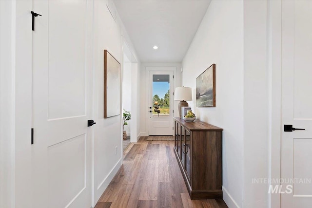 2394 E Monhegan Dr, Eagle, ID 83616 - entryway with baseboards, wood finished floors, and recessed lighting