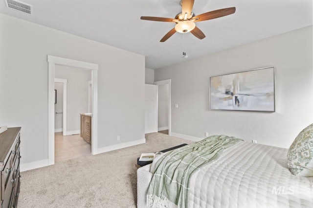 12462 S Sunrise Mist Loop, Nampa, ID 83686 - bedroom featuring light carpet, a ceiling fan, and ensuite bathroom