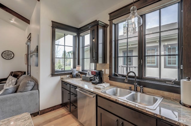 1520 Roosevelt Ave, Mccall, ID 83638 - kitchen with dishwasher, a sink, baseboards, decorative light fixtures, and light wood-style floors