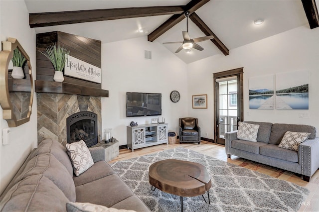 1520 Roosevelt Ave, Mccall, ID 83638 - living area with wood finished floors, a ceiling fan, and a large fireplace