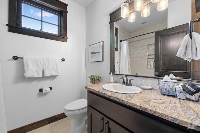 1520 Roosevelt Ave, Mccall, ID 83638 - bathroom with vanity, toilet, baseboards, curtained shower, and wood finished floors