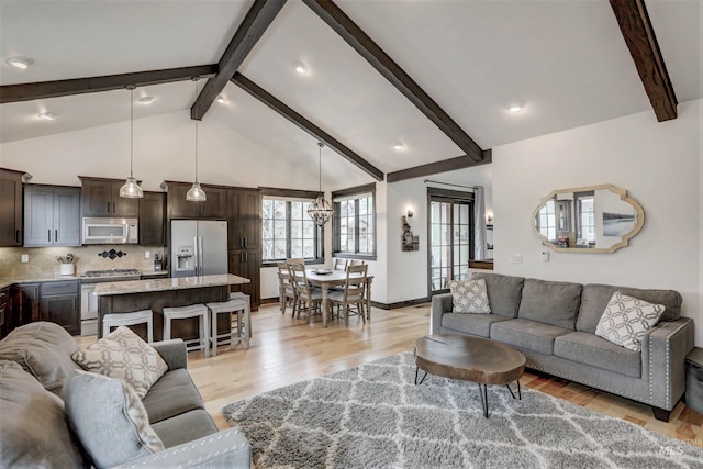 1520 Roosevelt Ave, Mccall, ID 83638 - living room with beamed ceiling, light wood finished floors, a chandelier, recessed lighting, and baseboards