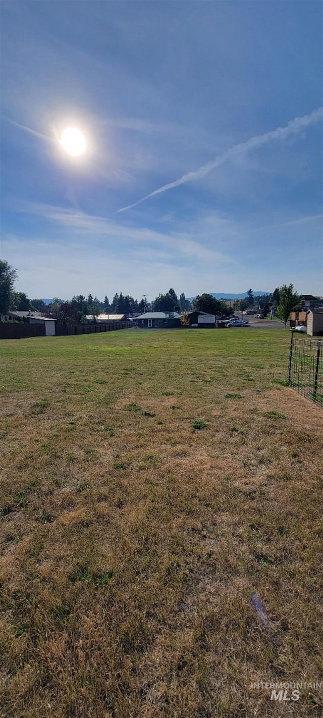 view of yard with a rural view