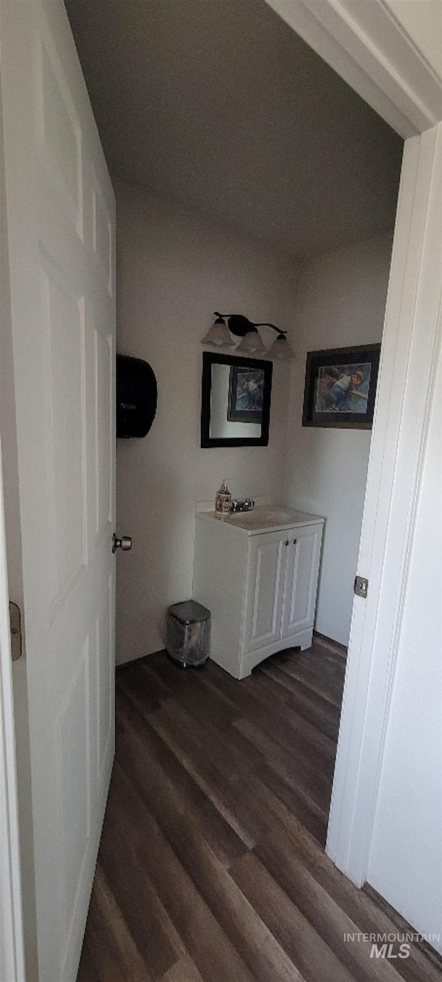 interior space with hardwood / wood-style flooring and vanity