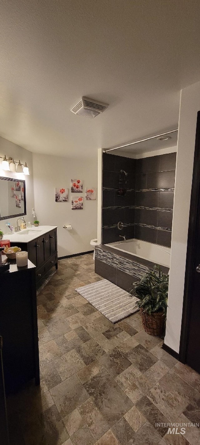 full bathroom with independent shower and bath, vanity, toilet, and a textured ceiling