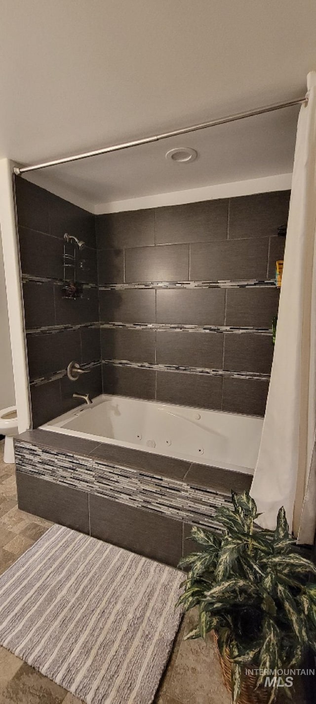 bathroom with shower / bath combo with shower curtain